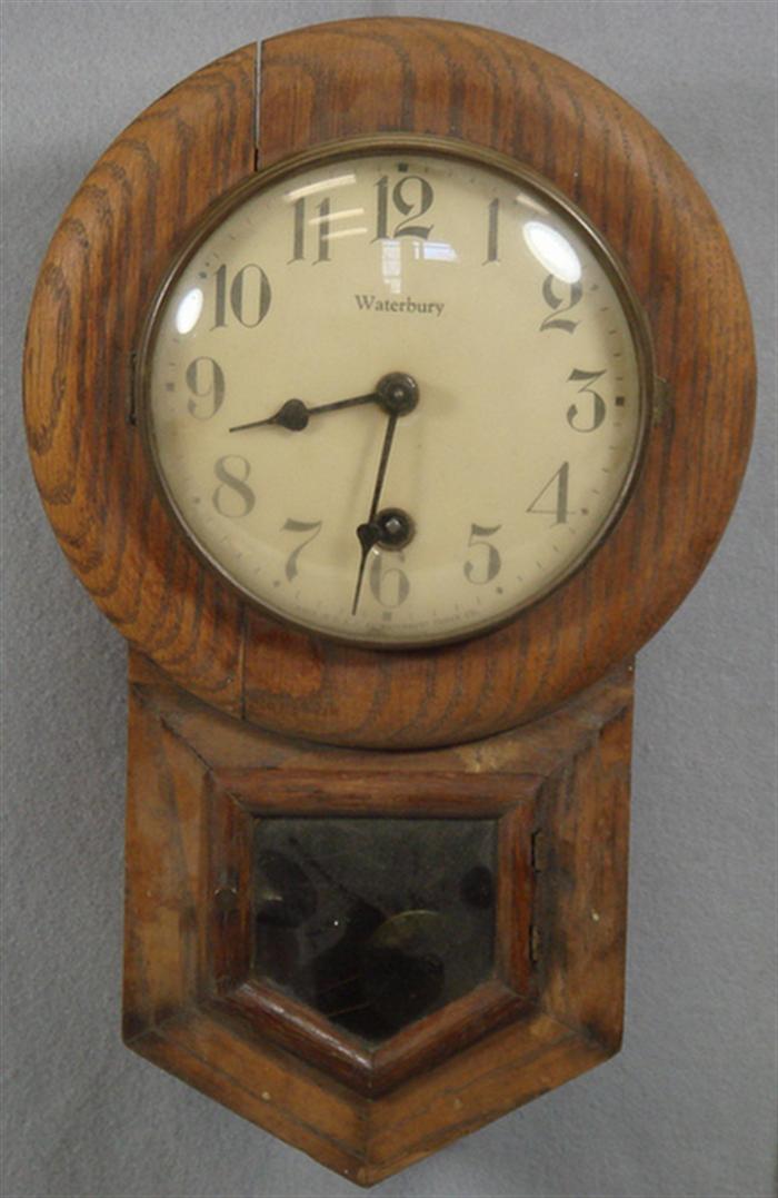 Appraisal: Waterbury oak schoolhouse clock time only h Estimate -