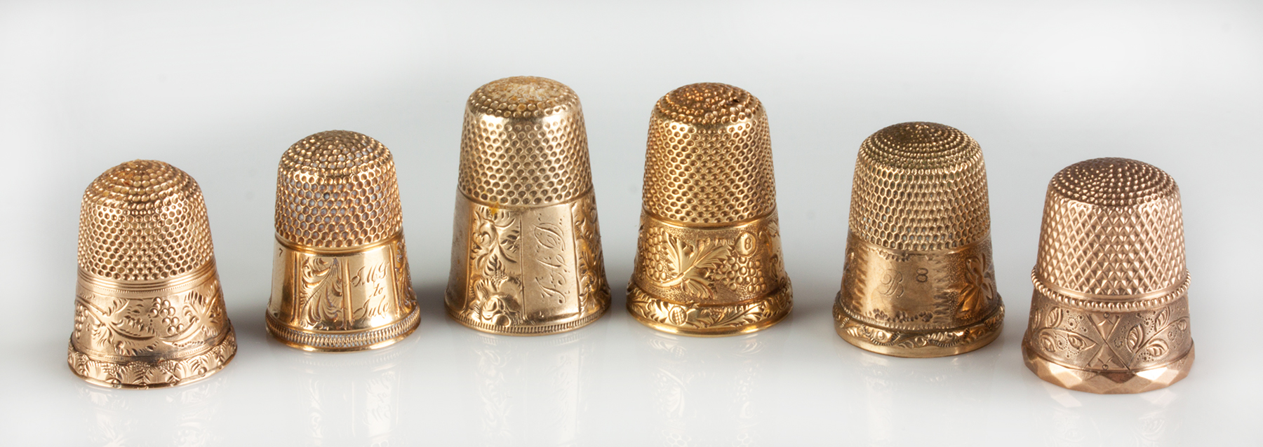 Appraisal: Six Gold Thimbles Four K gold thimbles dwt