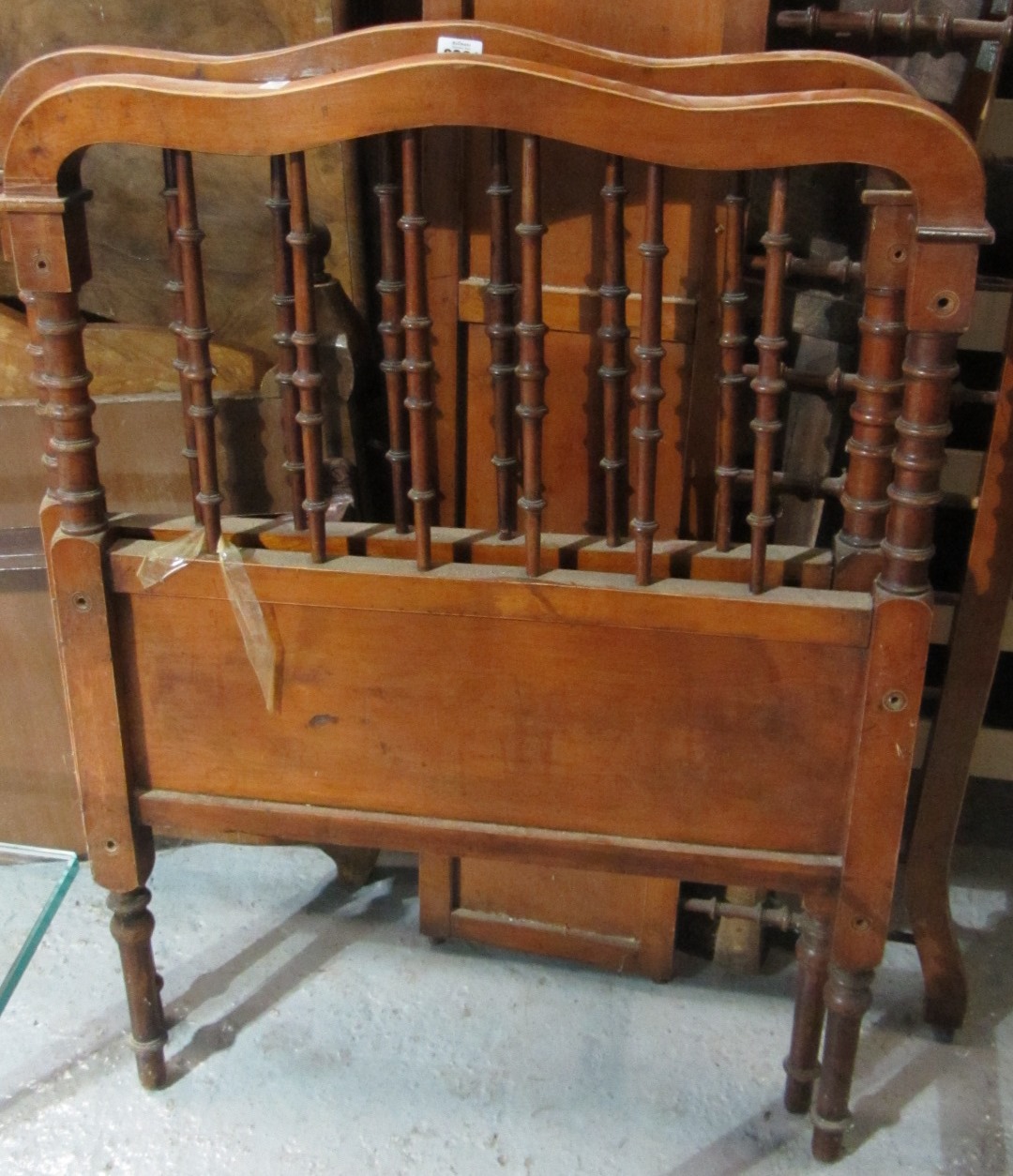 Appraisal: A French walnut cot with turned spindles