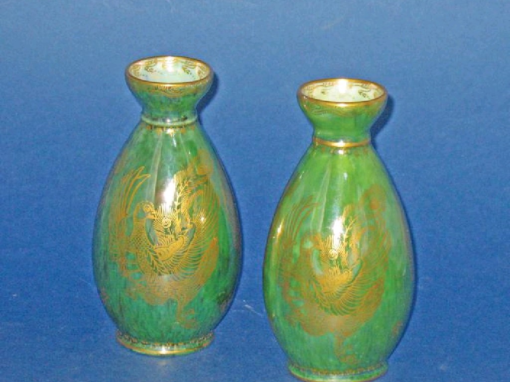 Appraisal: A PAIR OF WEDGWOOD DRAGON LUSTRE VASES of bellied form