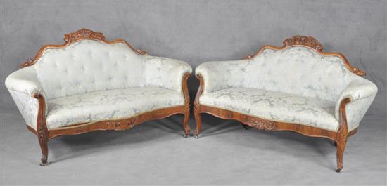 Appraisal: Pair of Victorian Loveseats Circa Finger carved rose crest rail