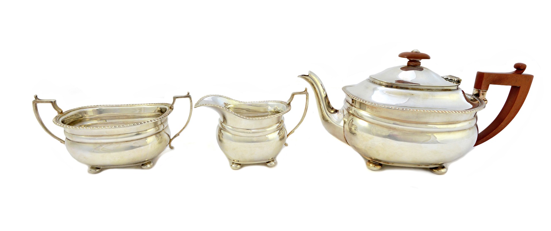 Appraisal: A silver three piece tea set comprising a teapot with