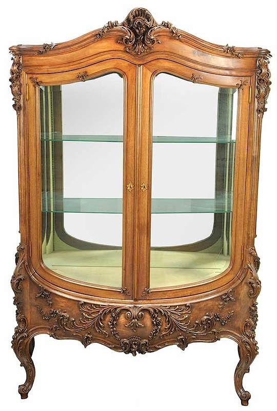 Appraisal: Louis XV Style Carved Walnut Bomb Vitrine French early th