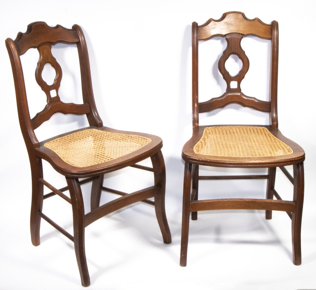 Appraisal: PAIR OF RED WALNUT COUNTRY CHAIRS CANED SEATS Early Eastlake