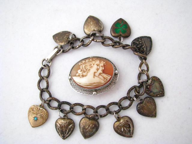 Appraisal: Vintage charm bracelet with sterling silver heart motif charms selling