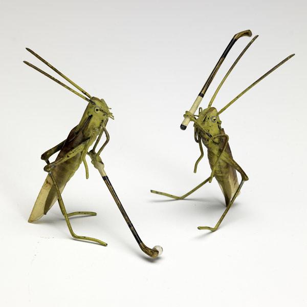 Appraisal: COLD PAINTED VIENNA BRONZES Two grasshoppers playing golf with celluloid