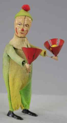 Appraisal: CLOWN JUGGLING BALL IN CONES Lithographed tin wears felt outfit