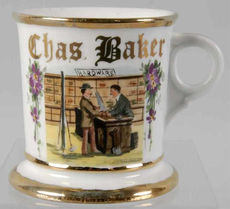 Appraisal: Hardware Store Scene Shaving Mug Description Gilt name Charles Baker