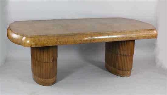 Appraisal: An Art Deco birds eye walnut dining table with sectional