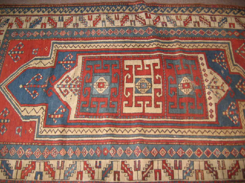 Appraisal: EARLY TH CENTURY TRIBAL KAZAK THROW RUG The red field