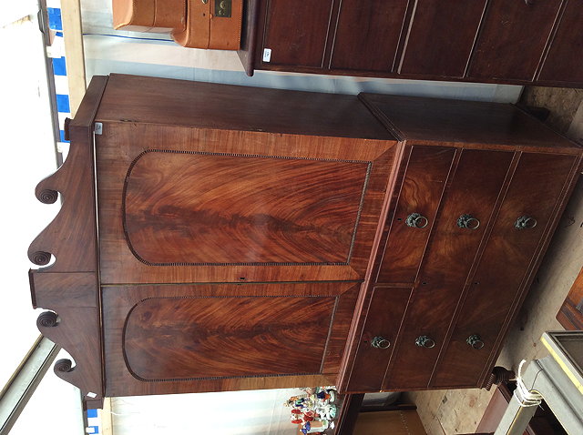 Appraisal: A TH CENTURY MAHOGANY LINEN PRESS with two panelled doors