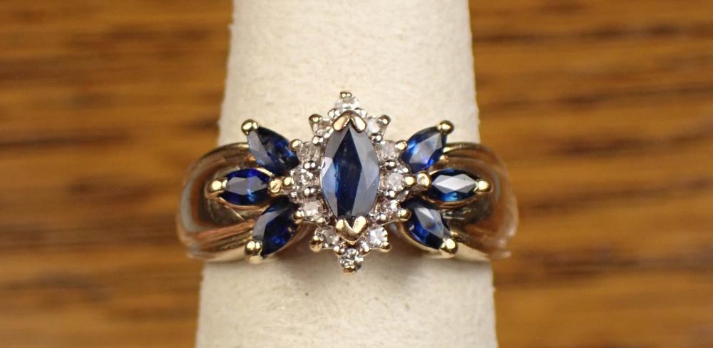 Appraisal: SAPPHIRE DIAMOND AND TWO-TONE GOLD RING The k yellow and