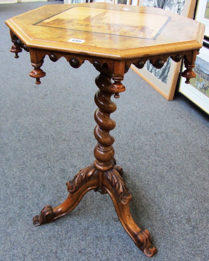 Appraisal: A Victorian figured walnut occasional table the octagonal snap top