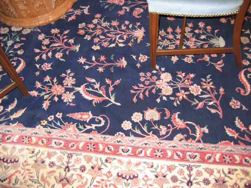 Appraisal: SINO-LILIHAN ROOM RUG The indigo field of scattered curvilinear floral