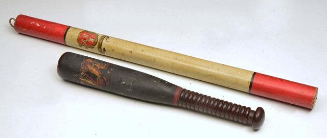 Appraisal: A VICTORIAN PAINTED WOODEN SHORT TRUNCHEON with turned wooden handle