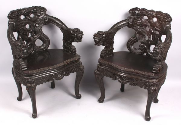 Appraisal: Pair of heavily carved Chinese armchairs h x w x