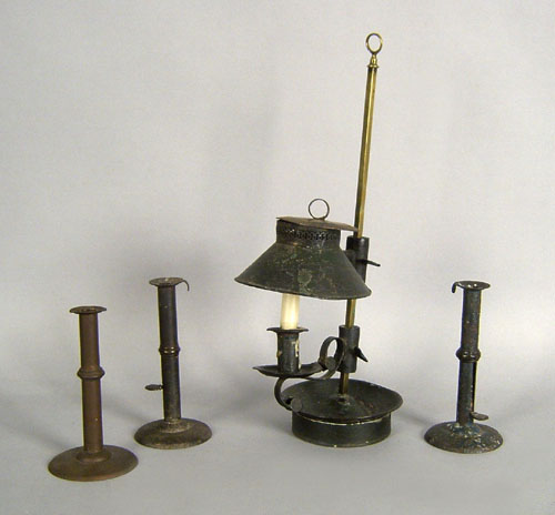 Appraisal: Tin table top lamp h together with three hogscraper candlesticks