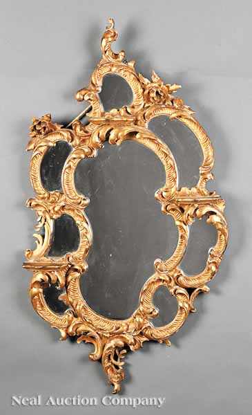 Appraisal: An Antique Continental Rococo Carved Giltwood Mirror late th c