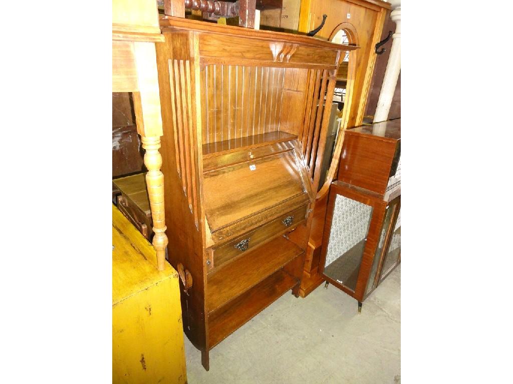 Appraisal: An Arts Crafts style slim oak bureau bookcase the panelled