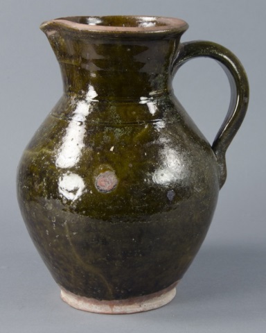 Appraisal: Ovoid Redware Pitcher with HandleMottled green alkaline glaze Having incised