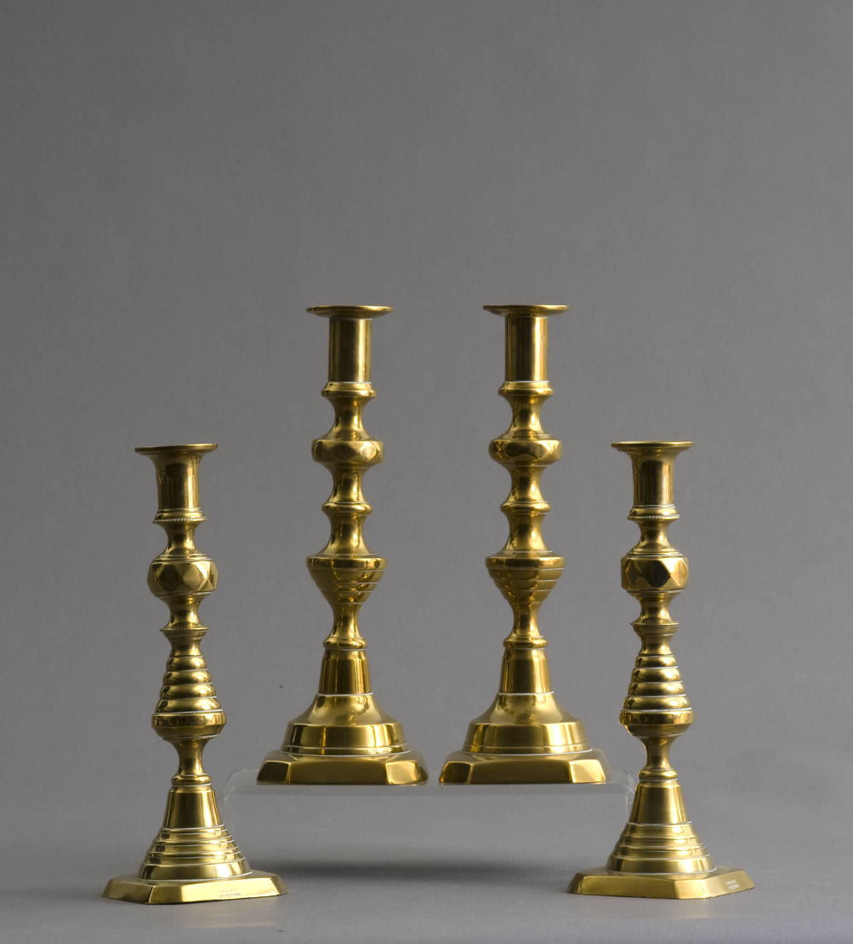 Appraisal: TWO PAIR OF ENGLISH BRASS CANDLESTICKS Height of tallest pair