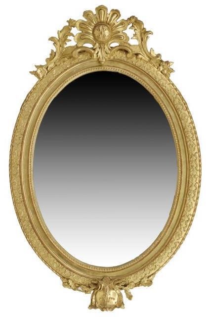 Appraisal: French giltwood wall mirror late th c oval frame with