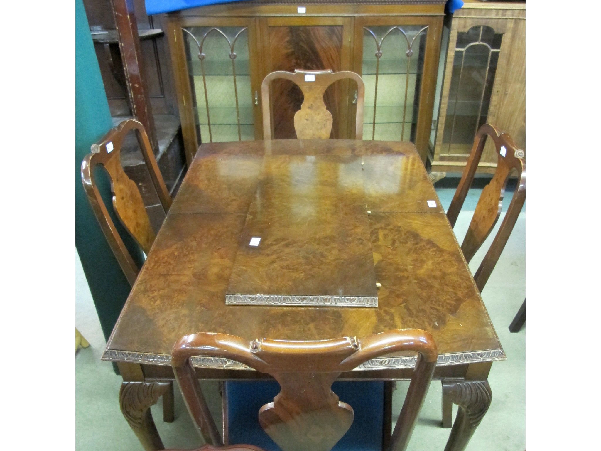 Appraisal: A th Century extending walnut dining table and four chairs