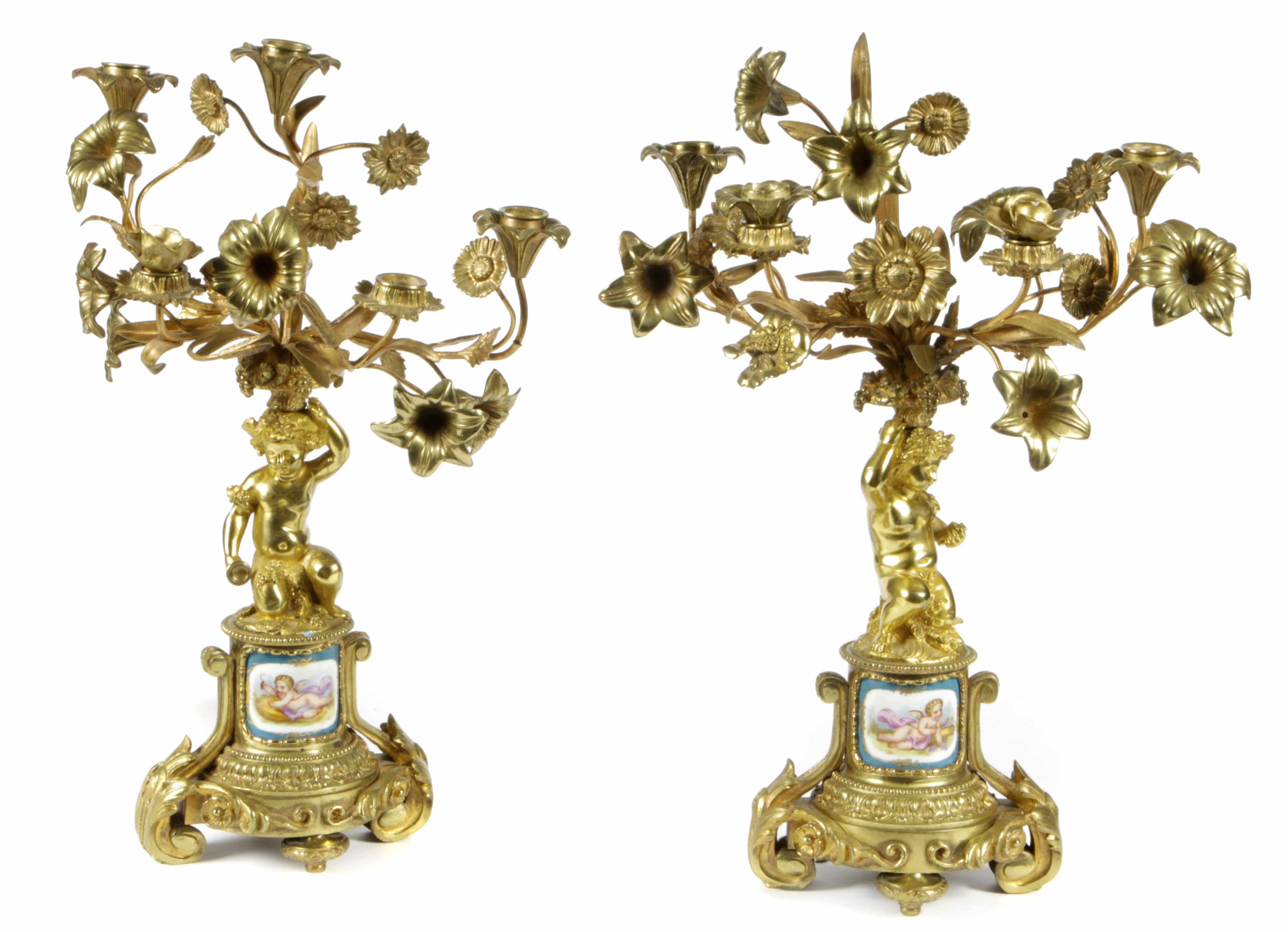 Appraisal: A pair of French five light figural and floral gilt