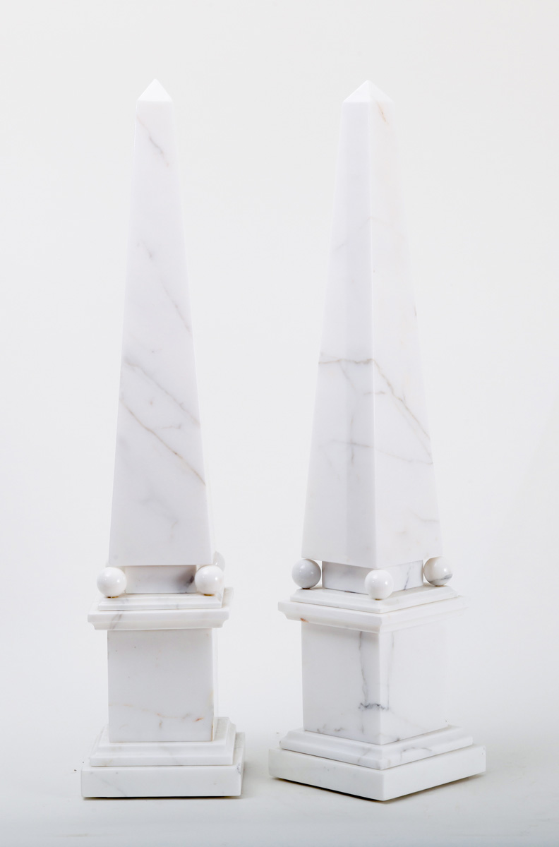 Appraisal: PAIR OF NEOCLASSICAL STYLE VEINED WHITE MARBLE OBELISKS Each resting