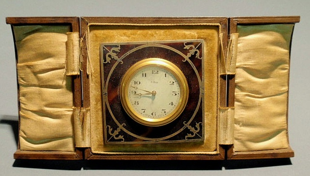 Appraisal: Swiss eight-day travel clock encased in tortoiseshell and silver overlay