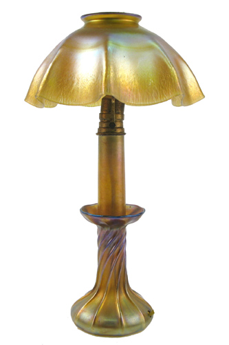 Appraisal: AN L C TIFFANY FAVRILE CANDLE LAMP the iridescent ruffled