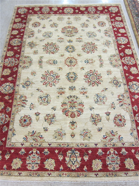 Appraisal: HAND KNOTTED ORIENTAL AREA RUG Pakistani Persian featuring a rectangular