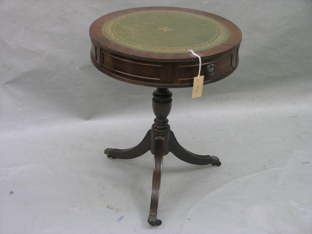 Appraisal: A Georgian style mahogany drum table with inset gilt tooled