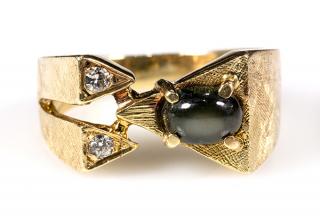 Appraisal: Black star sapphire diamond and k yellow gold ring Black