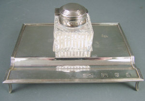 Appraisal: A modern silver inkwell on stand London with reeded edges