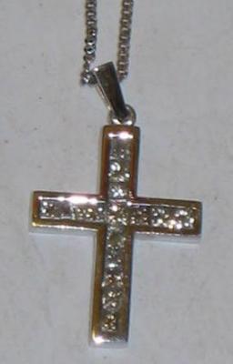 Appraisal: AN CT WHITE GOLD CROSS PENDANT set with princess cut