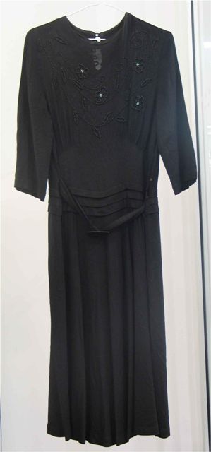 Appraisal: Dinner dress in black crepe with floral beaded decoration to