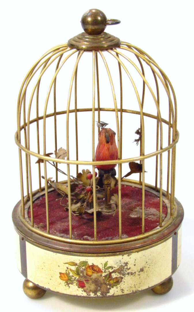 Appraisal: A thC bird automaton in a brass case with ring