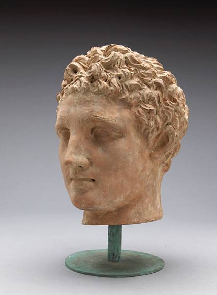 Appraisal: A terracotta head of a youth modern Raised on a