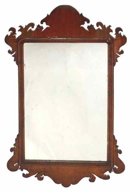 Appraisal: A GEORGIAN WALNUT FRET FRAME HANGING WALL MIRROR fitted old