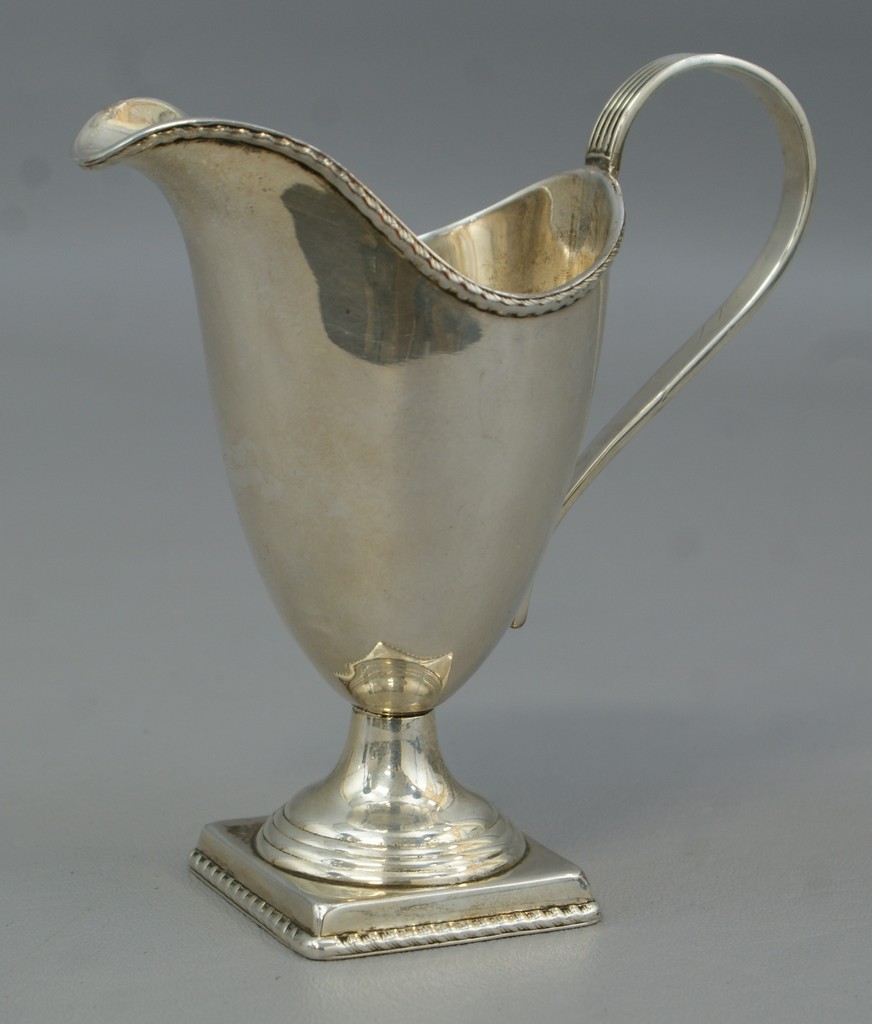 Appraisal: Unmarked American coin silver helmet pitcher reeded handle square pedestal