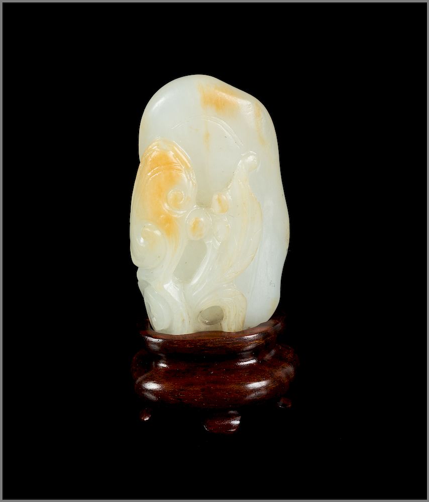 Appraisal: A Chinese Russet and White Jade Carving of Lingzhi Height