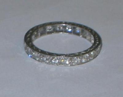 Appraisal: A DIAMOND FULL HOOP ETERNITY RING the brilliant cut stones