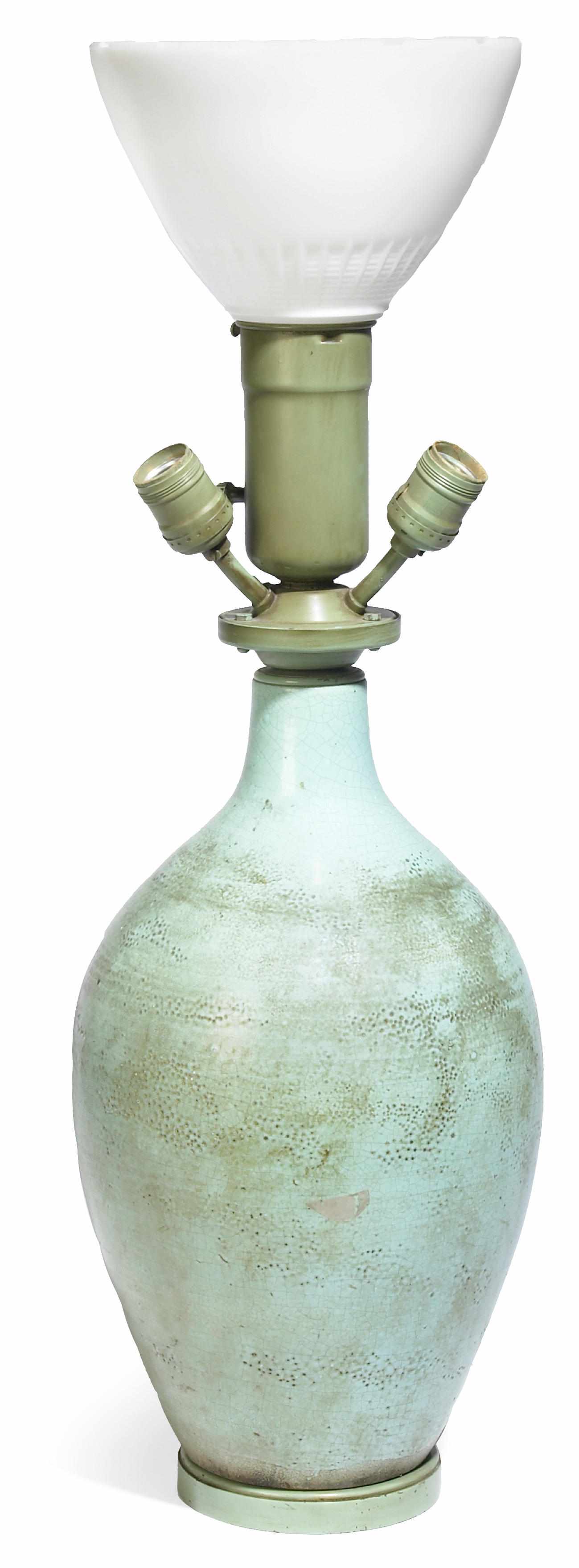 Appraisal: A French glazed earthenware vase mounted as a lamp the