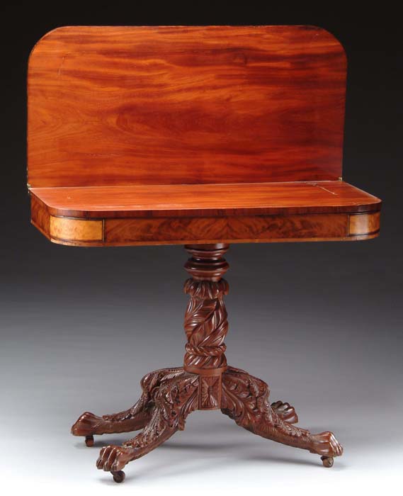 Appraisal: MAHOGANY CARVED EMPIRE CARD TABLE D-shaped top having fold over