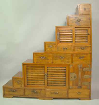 Appraisal: ASIAN HARDWOOD STEP CHEST the two pieces with stepped sides