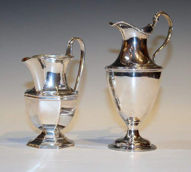 Appraisal: A GEORGE III SILVER CREAM JUG with scroll handle and