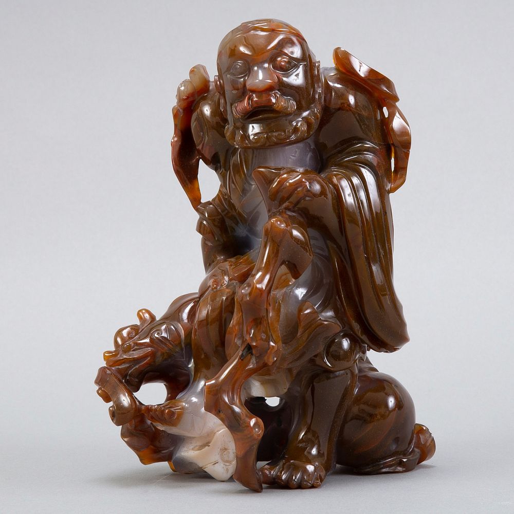 Appraisal: Large Chinese Agate Carving of a Traveler A very rare