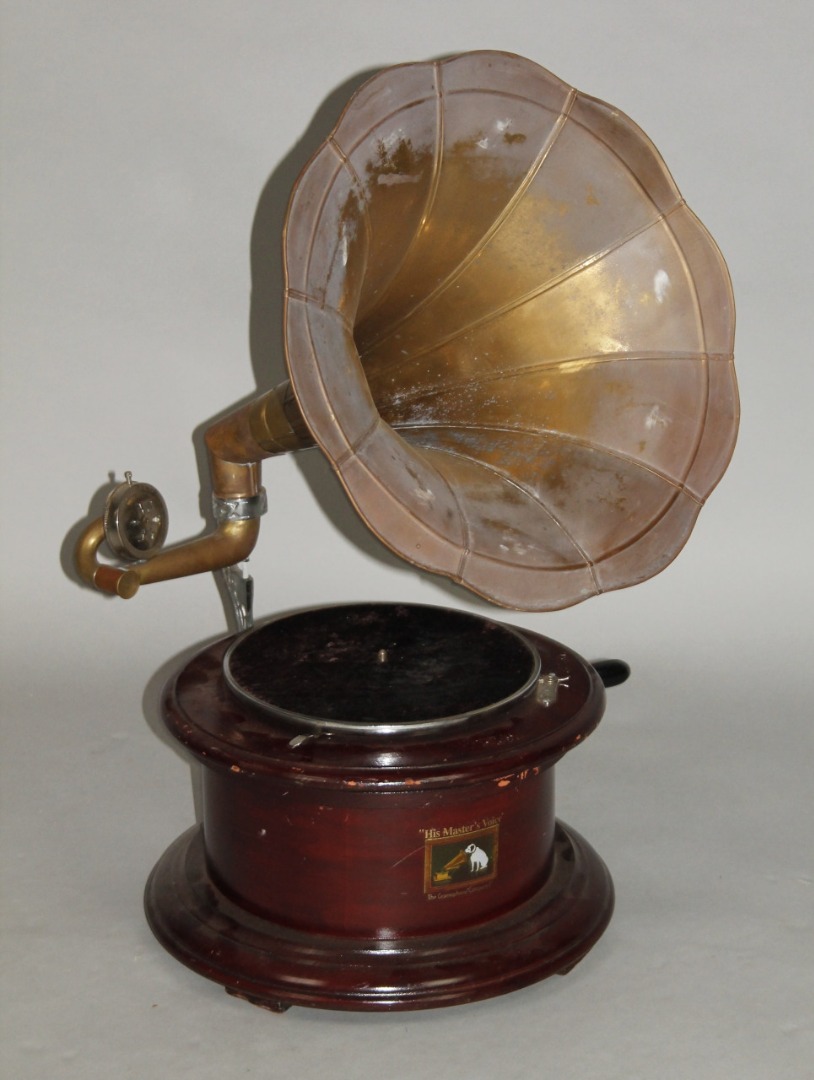 Appraisal: A thC HMV circular based gramaphone with brass horn the