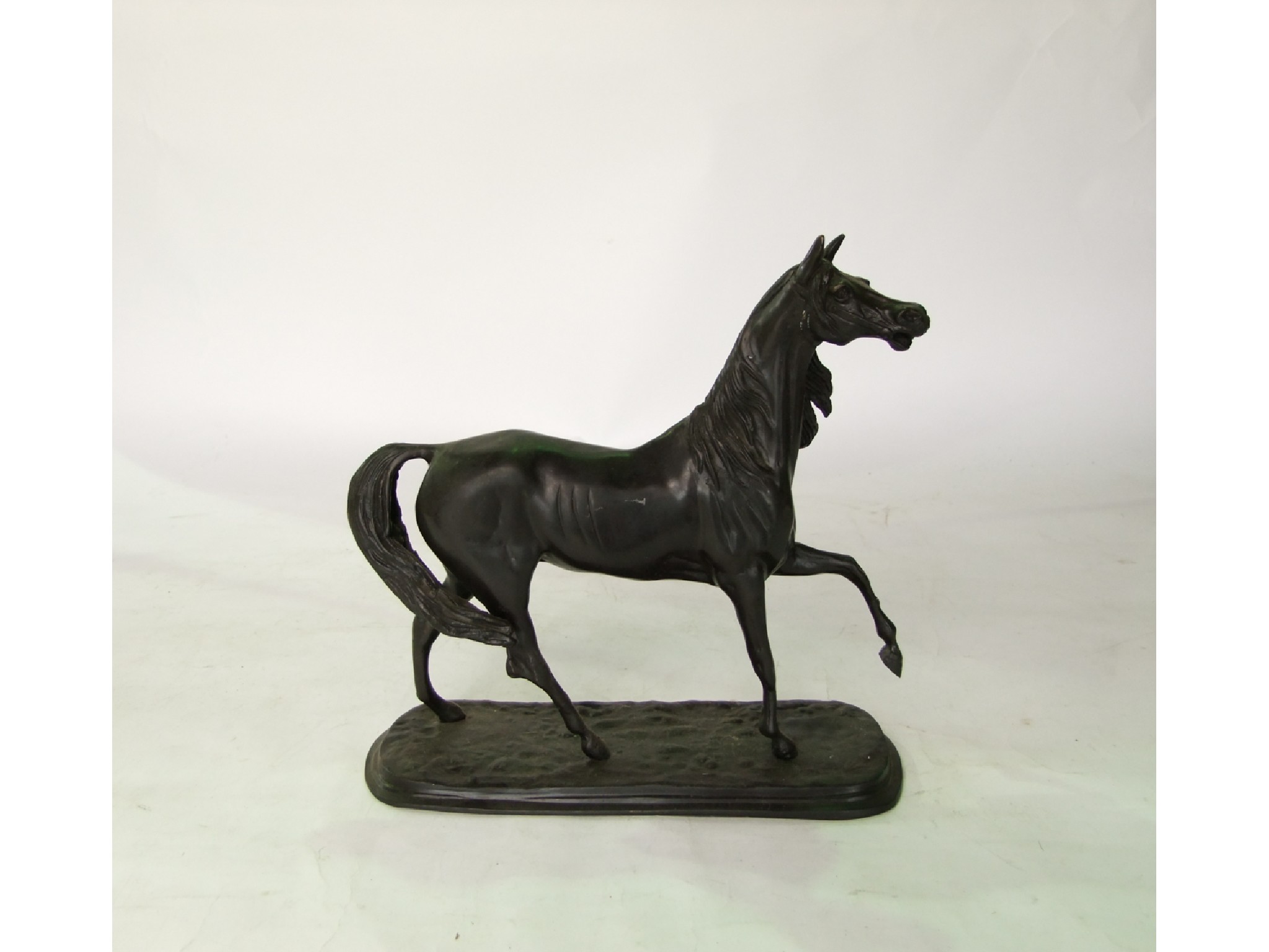 Appraisal: A cast metal study of a trotting horse raised on